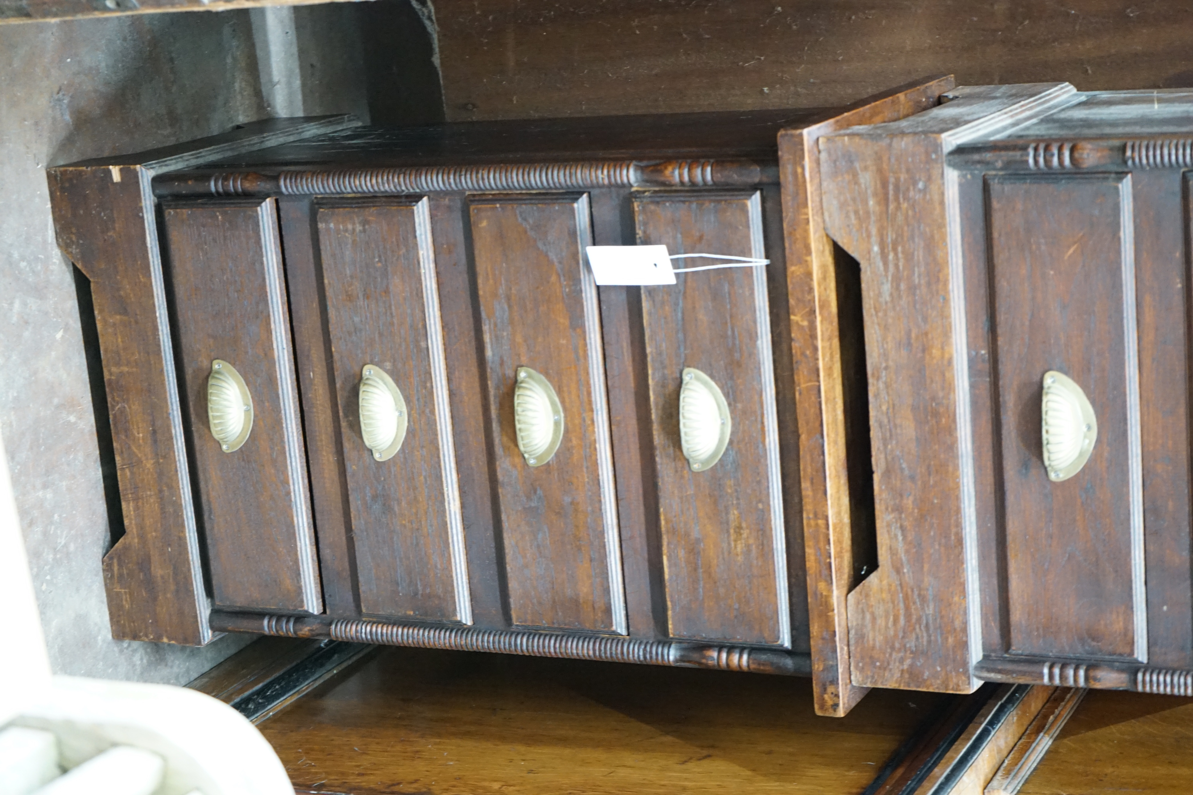 A pair of hardwood four drawer bedside chests, width 47cm depth 38cm height 74cm